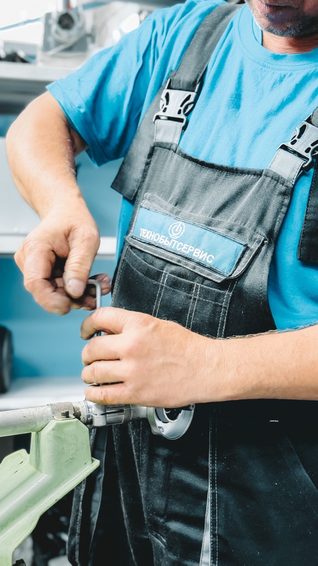 Plumber checking pipework beneath a residential sink