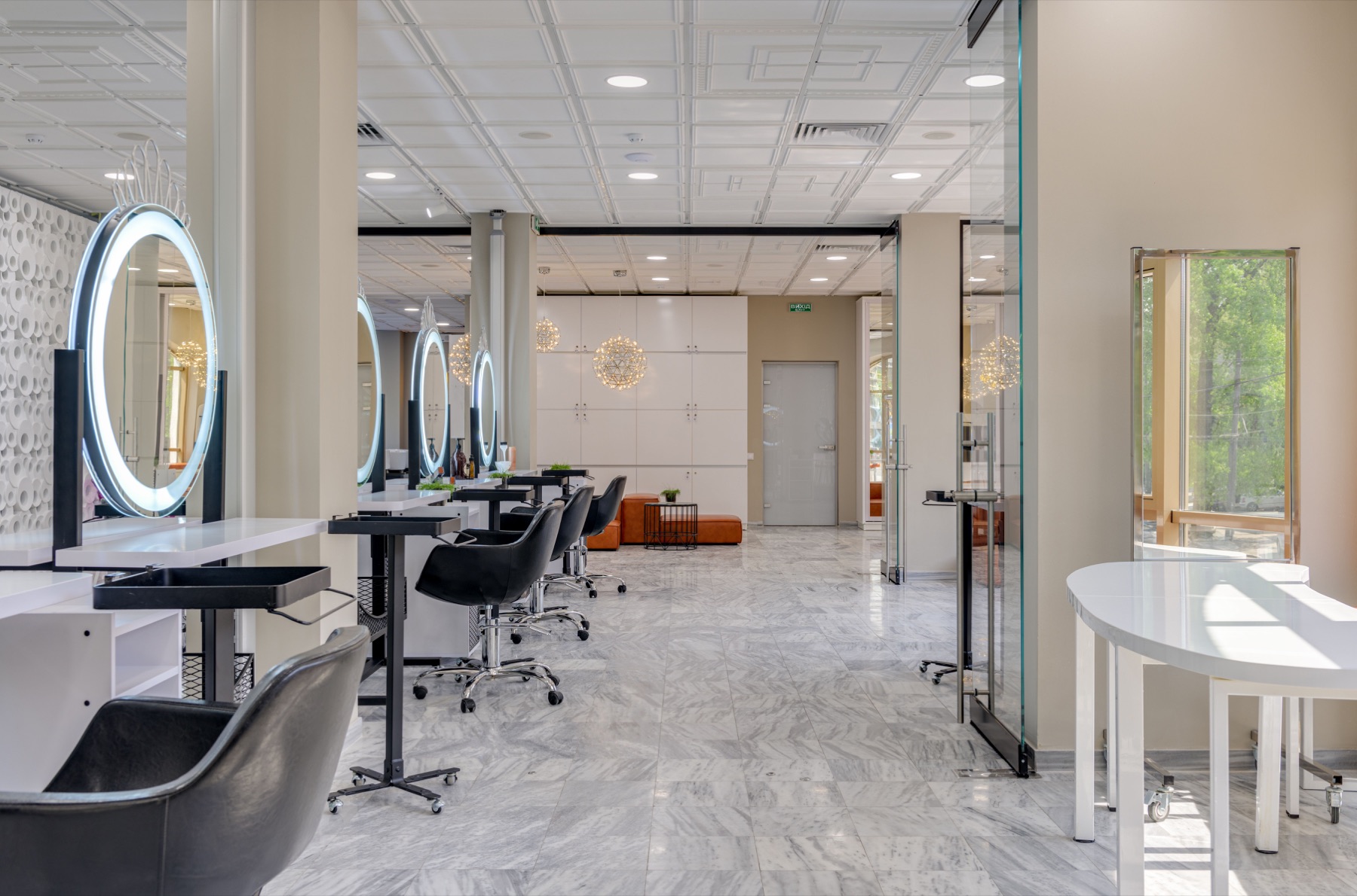 Stylist working with a client's hair in a clean salon setting